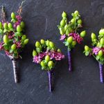 green and purple boutonnieres