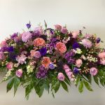 Shades of Purple and Pink Casket Spray