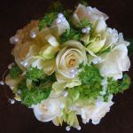 white rose and daffodil with pearl garland bridal bouquet