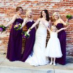 purple and blue bridal bouquet and bridesmaids