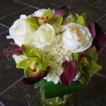 white rose, green cymbidium orchid, purple mini calla lily bouquet